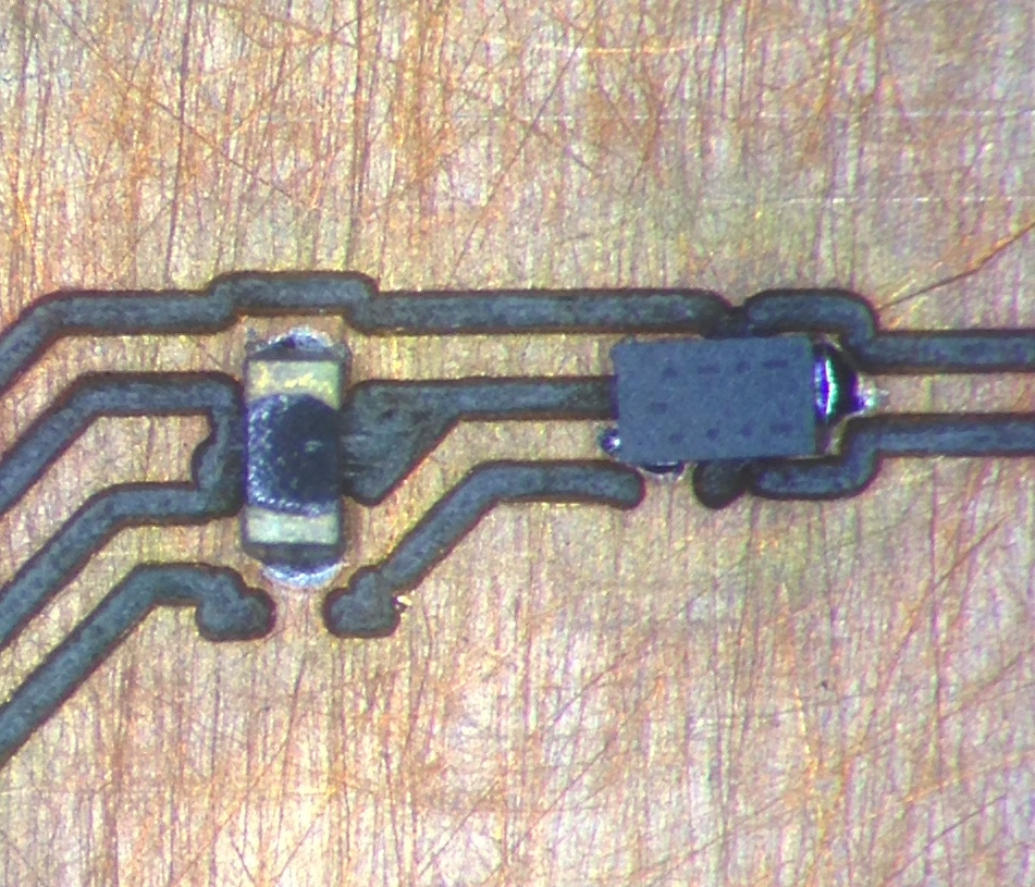 A 0402 resistor and a similar sized transistor
